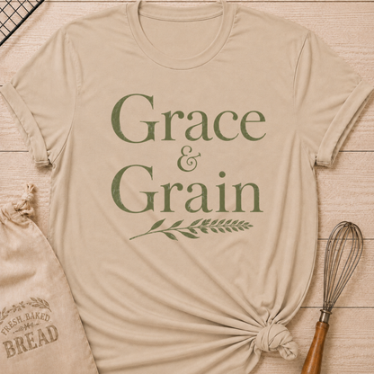 Heather stone women's relaxed fit t-shirt with the words Grace and Grain in vintage lettering and a delicate wheat sprig.