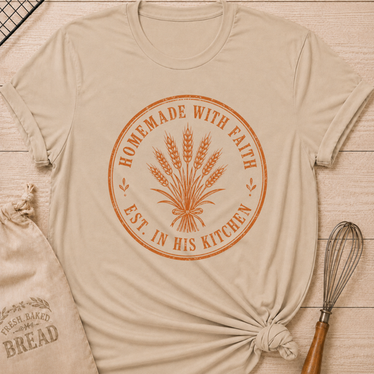 Heather stone women's relaxed fit t-shirt with the words Homemade with Faith in a vintage market emblem around a tied bundle of wheat.