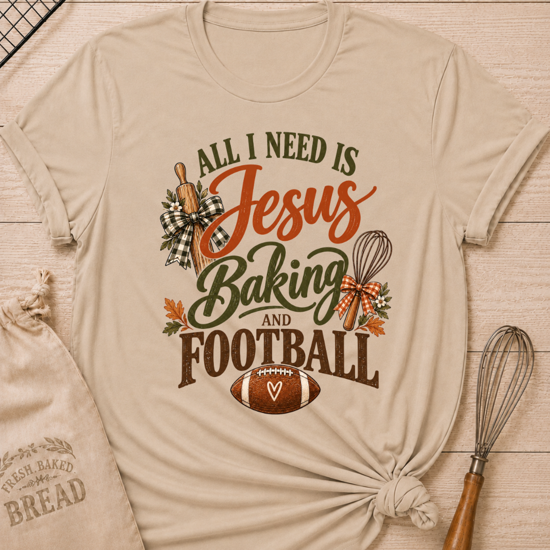 Heather Stone women's relaxed fit tee with bold vintage All I Need Is Jesus Baking and Football lettering, a rolling pin, whisk, gingham bows, autumn leaves and a classic football