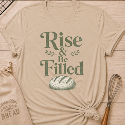 Heather stone women's relaxed fit t-shirt with the words Rise and Be Filled in vintage lettering above a rustic loaf of bread and leafy accents.