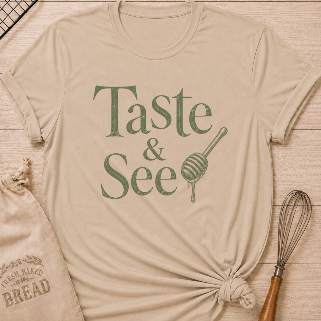 Heather stone women's relaxed fit t-shirt with the words Taste and See in vintage lettering and a dripping honey dipper.