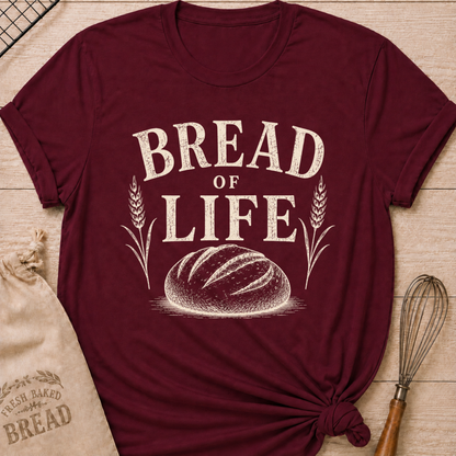 Maroon Bread of Life women's relaxed fit tee with bold vintage lettering and a rustic loaf framed by wheat
