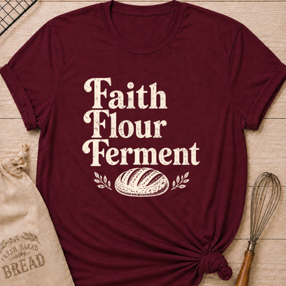 Maroon women's relaxed fit t-shirt with the words Faith, Flour, Ferment in bold vintage lettering with a classic artisan loaf and subtle leafy accents.