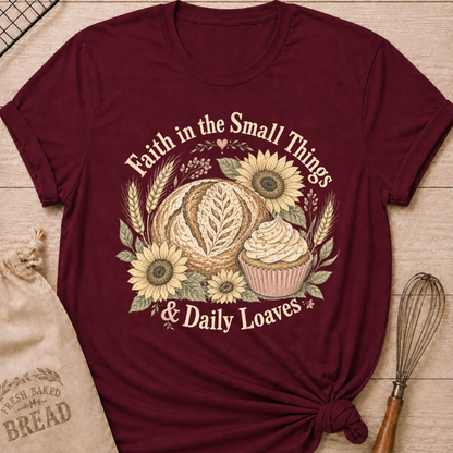 Maroon Faith In The Small Things women's relaxed fit tee with artisan bread, a frosted cupcake, sunflowers, and wheat