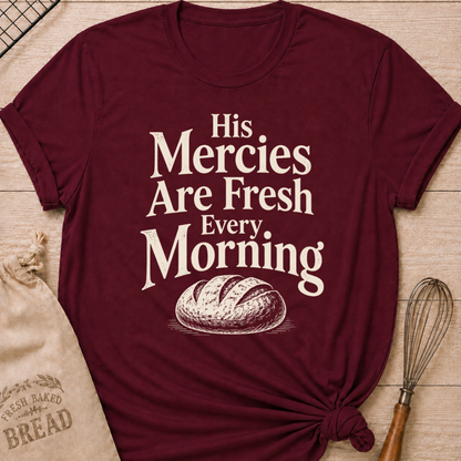 Maroon women's relaxed fit t-shirt with the words His Mercies Are Fresh Every Morning above a rustic loaf of bread.