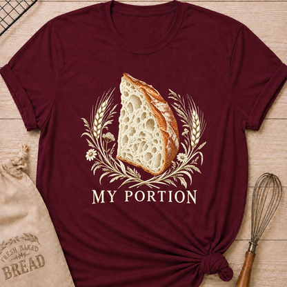 Maroon women's relaxed fit tee with a detailed slice of artisan bread framed by wheat and delicate wildflowers in warm earthy tones, with My Portion lettering below