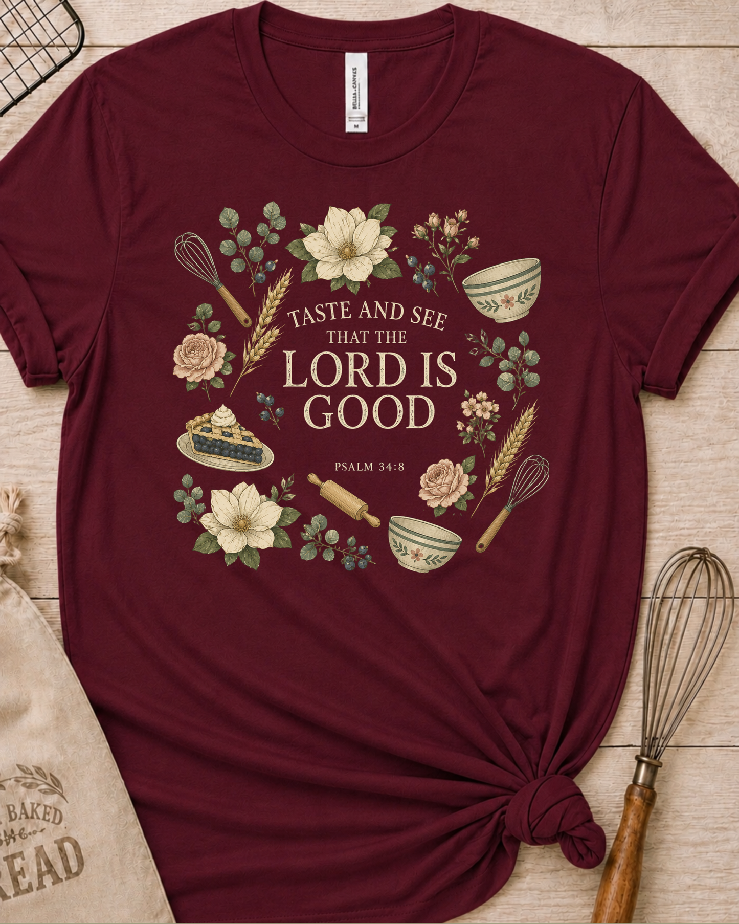 Maroon women's relaxed fit t-shirt with Taste and See from Psalm 34:8 inside a soft botanical wreath.
