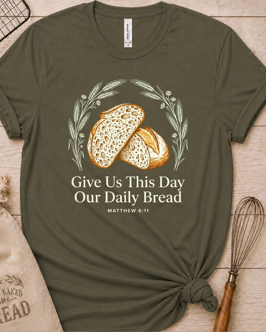 Military green women's relaxed fit t-shirt with the Daily Bread design featuring two rustic half loaves side by side, inspired by Matthew 6:11.