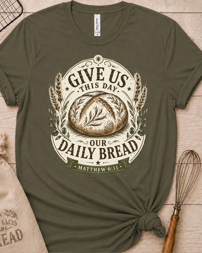 Military green women's relaxed fit t-shirt with the Daily Bread emblem printed in cream, a clean badge-style bread illustration inspired by Matthew 6:11.