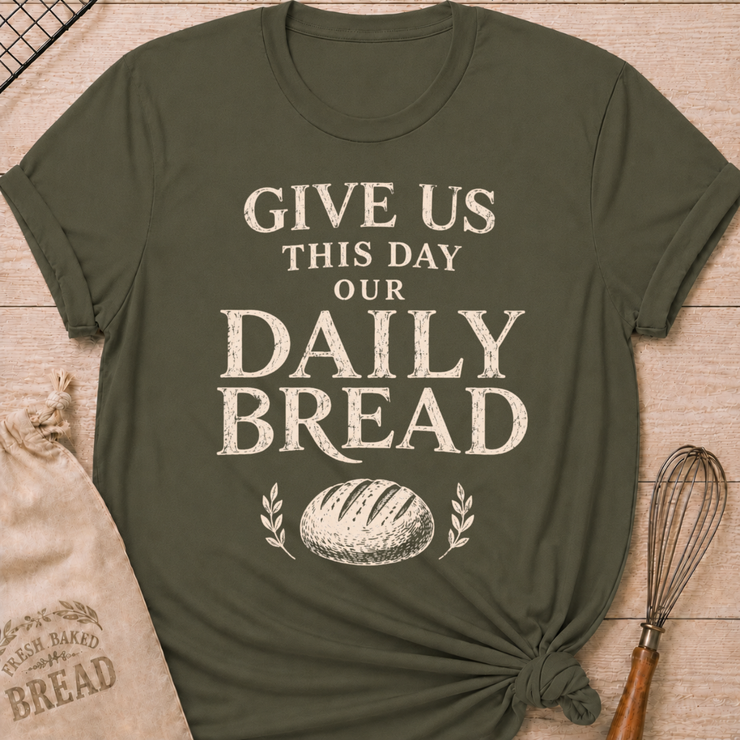 Military green women's relaxed fit t-shirt with the words Give Us This Day Our Daily Bread in bold vintage lettering above a rustic loaf and leafy accents.