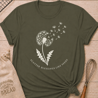 Military green women's relaxed fit t-shirt with a dandelion releasing its seeds and the words Scatter Blessings Like Seeds.