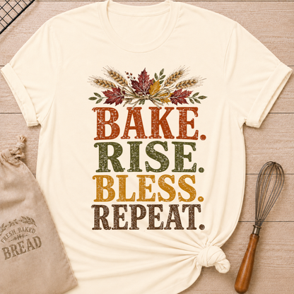 Natural women's relaxed fit tee with distressed vintage Bake Rise Bless Repeat lettering and a tied bundle of wheat and autumn leaves