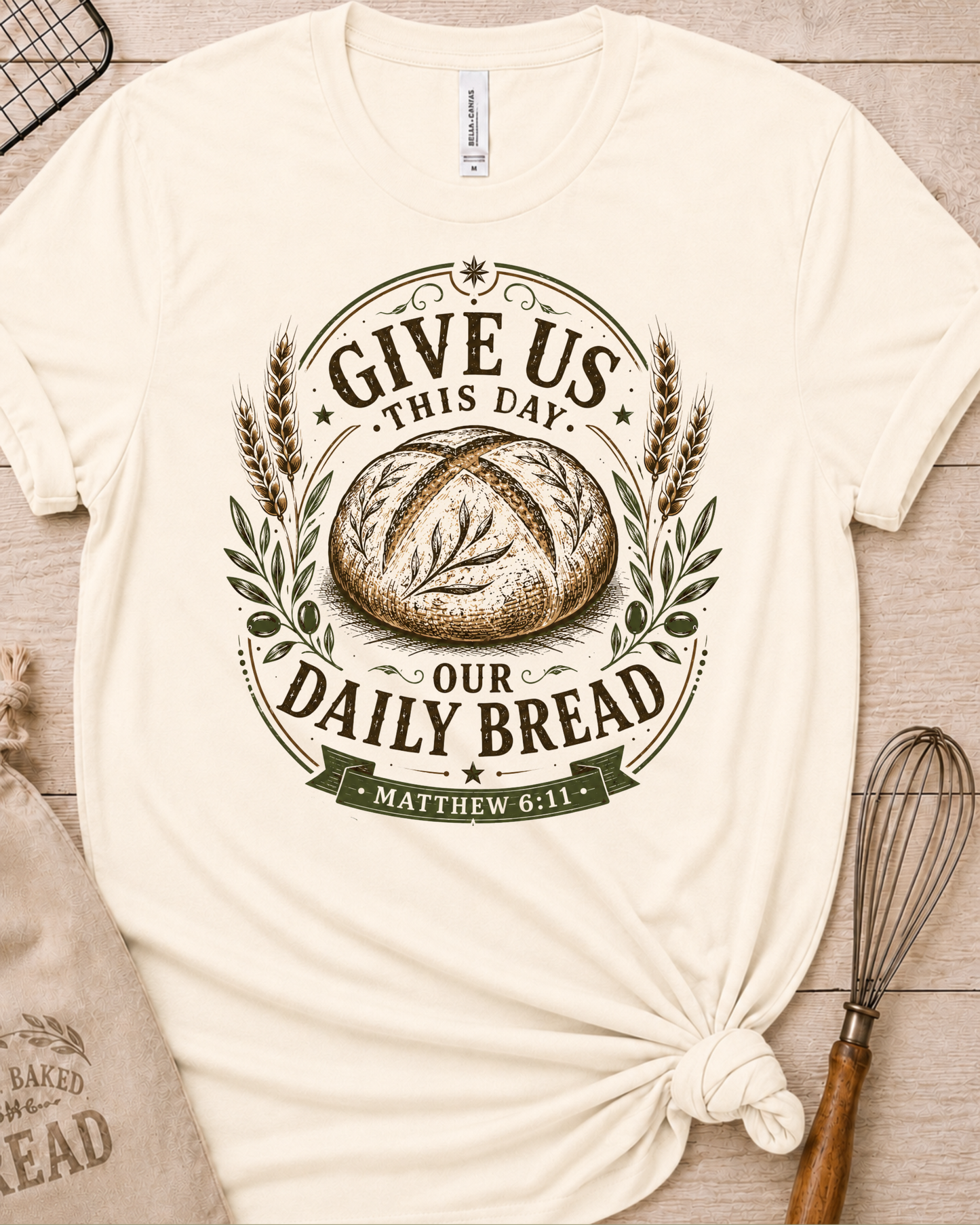 Natural cream women's relaxed fit t-shirt with the Daily Bread emblem, a clean badge-style bread illustration inspired by Matthew 6:11.