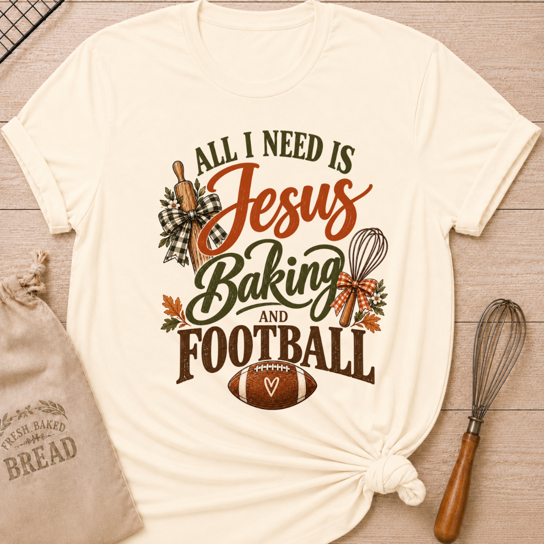Natural women's relaxed fit tee with bold vintage All I Need Is Jesus Baking and Football lettering, a rolling pin, whisk, gingham bows, autumn leaves and a classic football