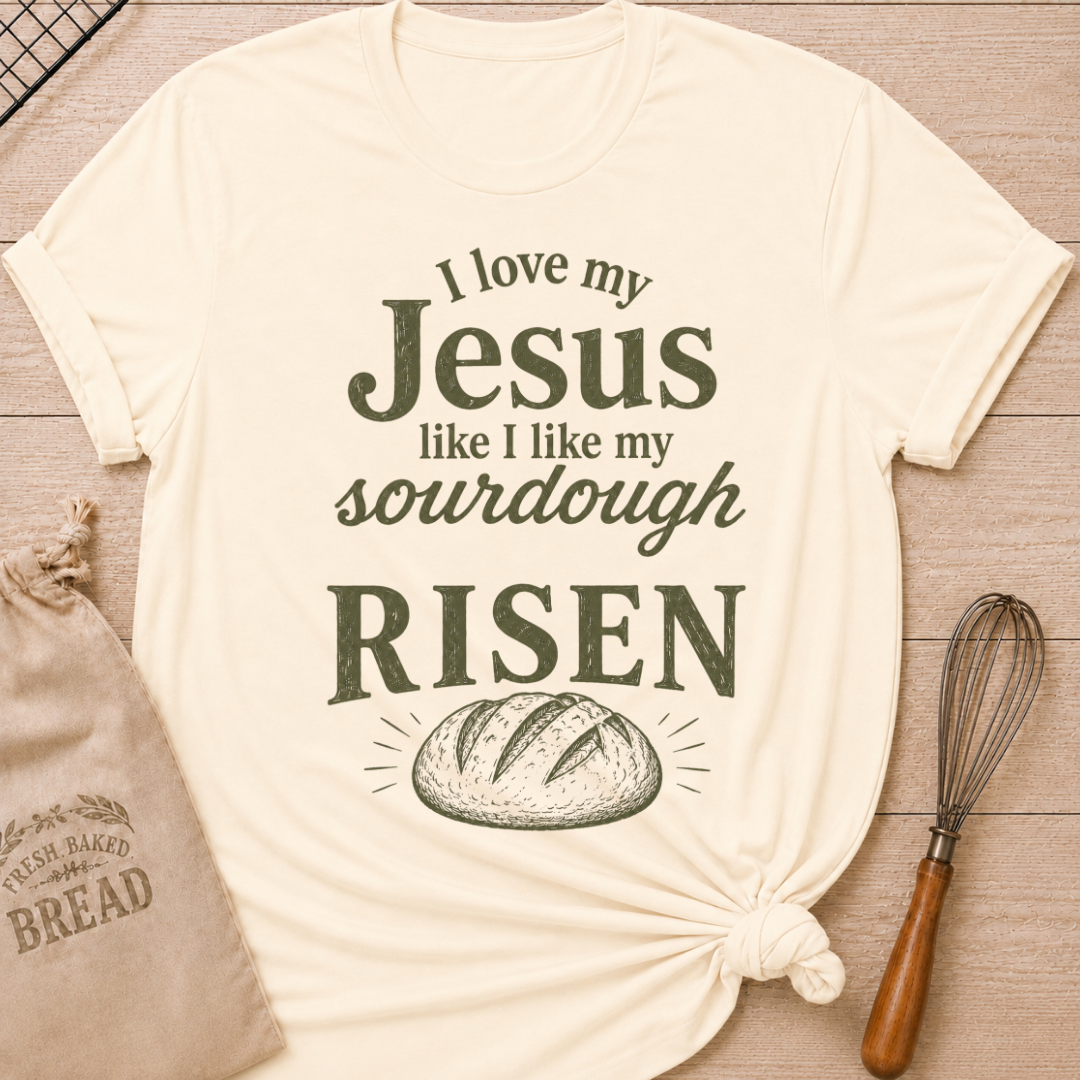 Natural women's relaxed fit t-shirt with the words I Love My Jesus Like I Like My Sourdough, Risen in bold vintage lettering and a rustic loaf of bread.