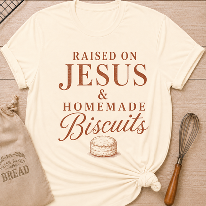 Natural Raised On Jesus and Homemade Biscuits women's relaxed fit tee with warm vintage typography and a classic biscuit