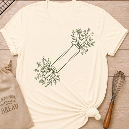 Natural women's relaxed fit t-shirt with a rolling pin dressed in soft floral sprigs and bows.