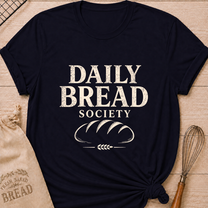 Navy women's relaxed fit t-shirt with the words Daily Bread Society in bold vintage lettering above a classic loaf and wheat.