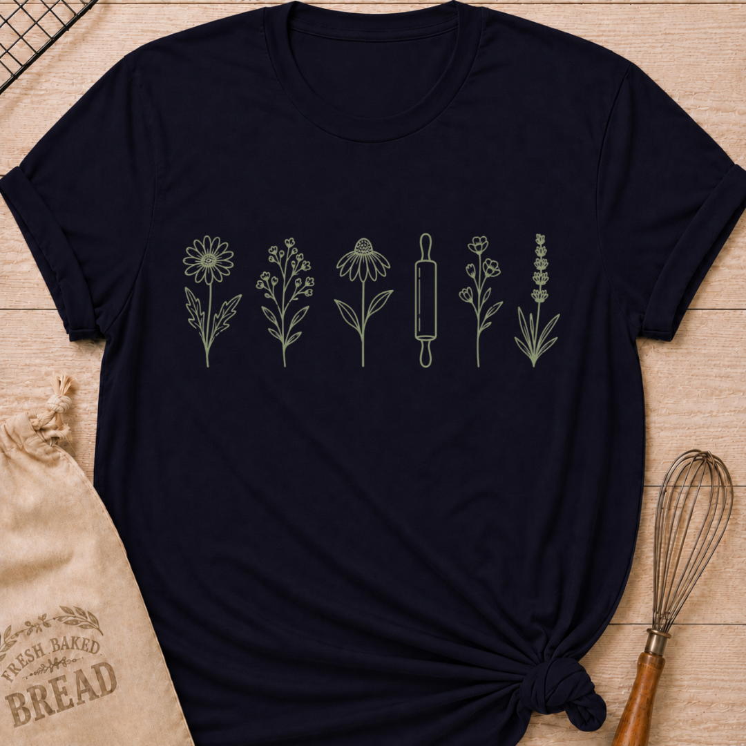 Navy women's relaxed fit t-shirt with a classic rolling pin and a row of delicate wildflowers in soft sage and cream.