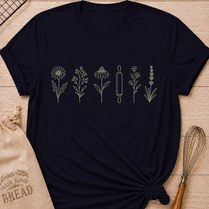 Navy women's relaxed fit t-shirt with a classic rolling pin and a row of delicate wildflowers in soft sage and cream.