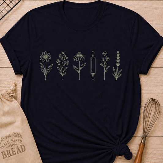 Navy women's relaxed fit t-shirt with a classic rolling pin and a row of delicate wildflowers in soft sage and cream.