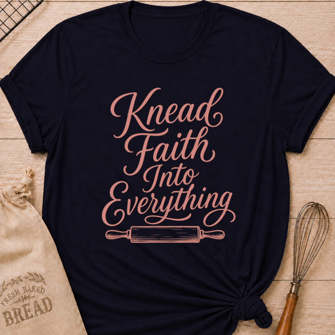 Navy women's relaxed fit t-shirt with Knead Faith Into Everything in graceful script and a classic rolling pin.