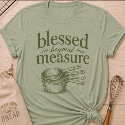 Sage green women's relaxed fit t-shirt with the words Blessed Beyond Measure in vintage lettering and a stack of measuring cups.