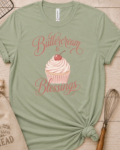 Sage green women's relaxed fit t-shirt reading Buttercream and Blessings with a frosted cupcake illustration.
