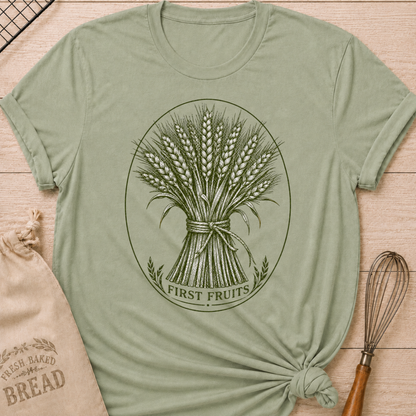 Sage women's relaxed fit tee with a detailed bundle of wheat tied by hand and framed in a classic vintage oval, with First Fruits lettering