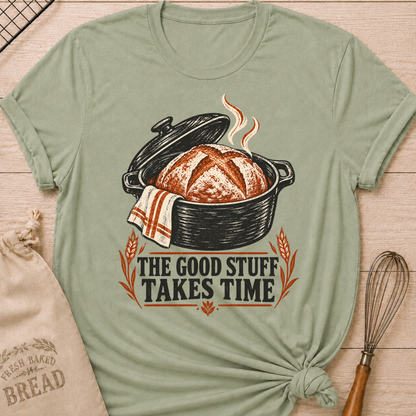 Sage women's relaxed fit tee with a warm artisan loaf rising from a classic Dutch oven with wheat accents and vintage distressed Good Stuff Takes Time lettering