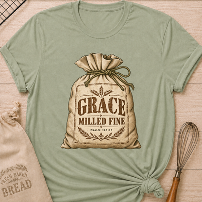 Sage women's relaxed fit tee with a vintage flour sack tied with rope, detailed with wheat motifs, Grace Milled Fine lettering and Psalm 145:15