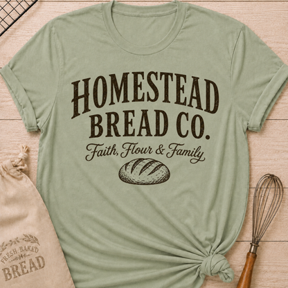 Sage green women's relaxed fit t-shirt with a vintage bread graphic and the words Homestead Bread Co. Faith, Flour and Family.
