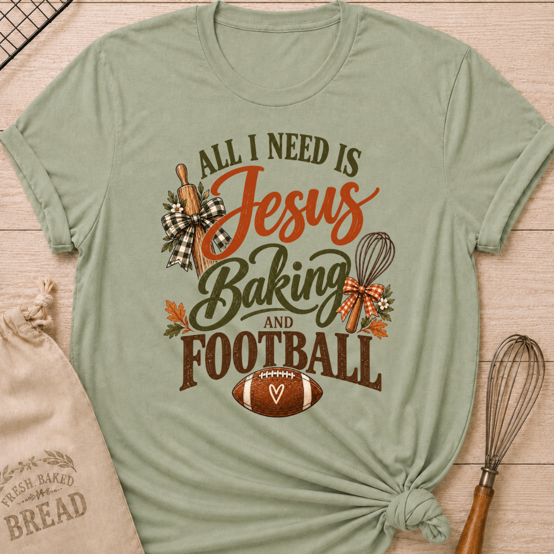 Sage women's relaxed fit tee with bold vintage All I Need Is Jesus Baking and Football lettering, a rolling pin, whisk, gingham bows, autumn leaves and a classic football
