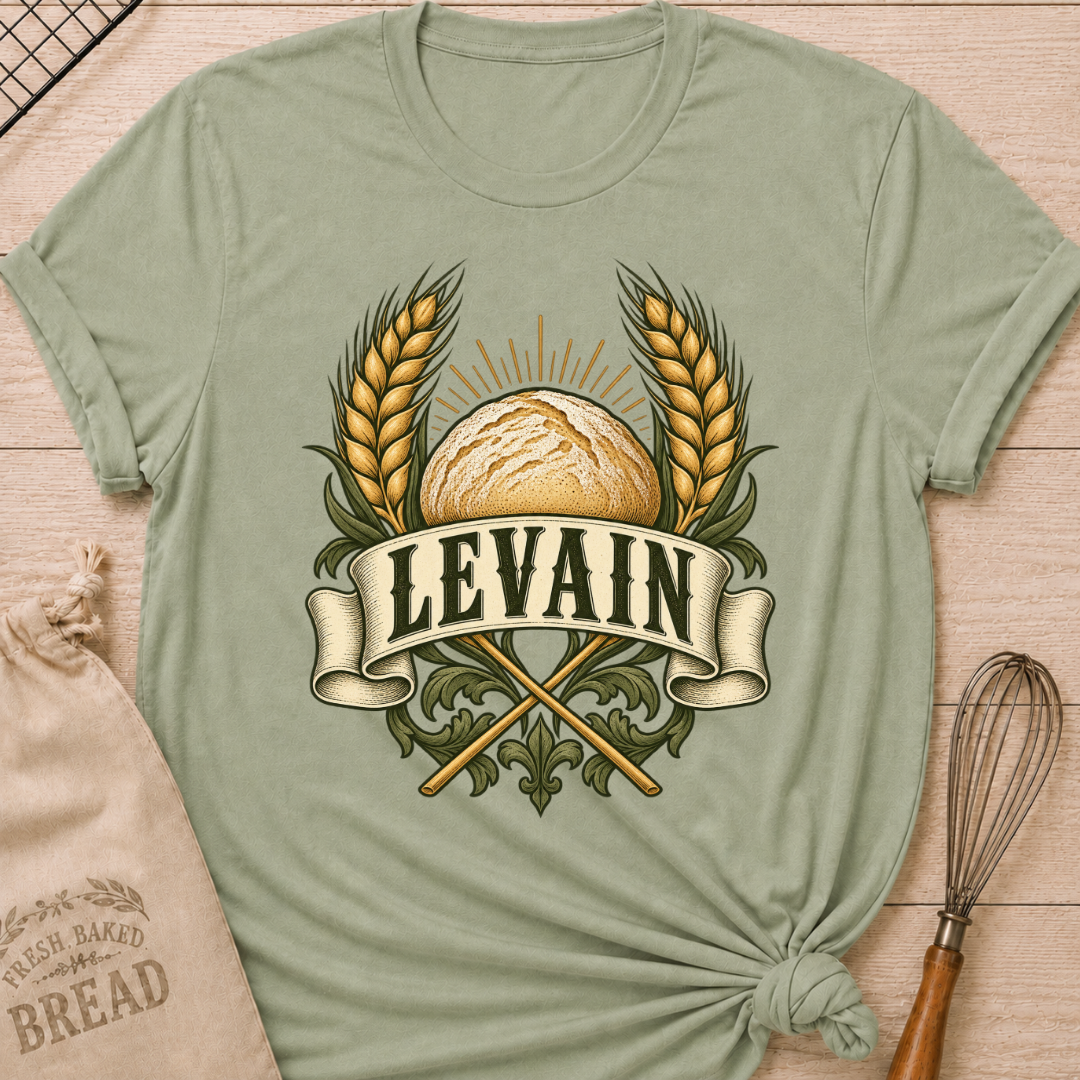 Sage women's relaxed fit tee with a rustic loaf between golden wheat and radiant accents, with Levain lettering on an old-world banner