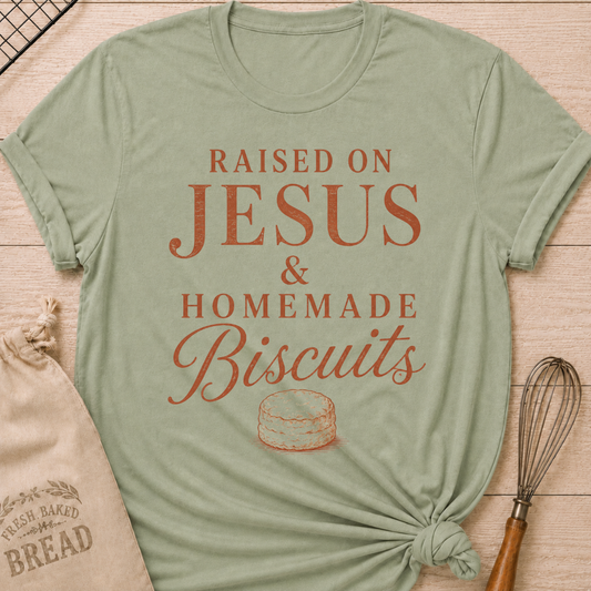 Sage Raised On Jesus and Homemade Biscuits women's relaxed fit tee with warm vintage typography and a classic biscuit