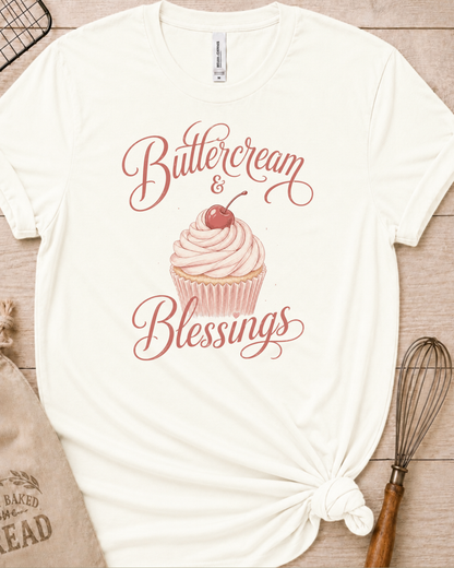 Vintage white women's relaxed fit t-shirt reading Buttercream and Blessings with a frosted cupcake illustration.