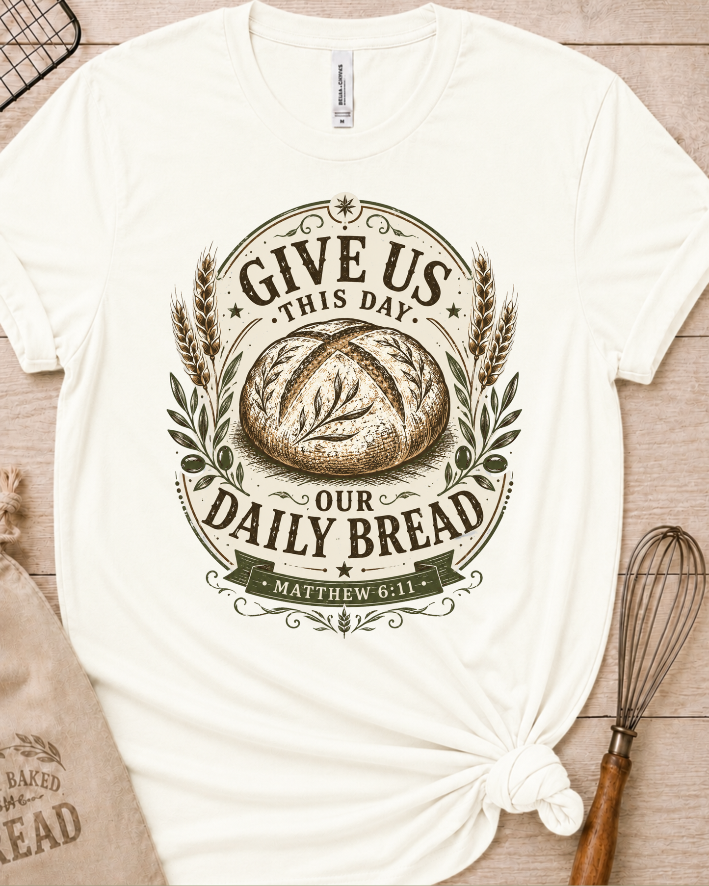 Vintage white women's relaxed fit t-shirt with the Daily Bread emblem printed in cream, a clean badge-style bread illustration inspired by Matthew 6:11.