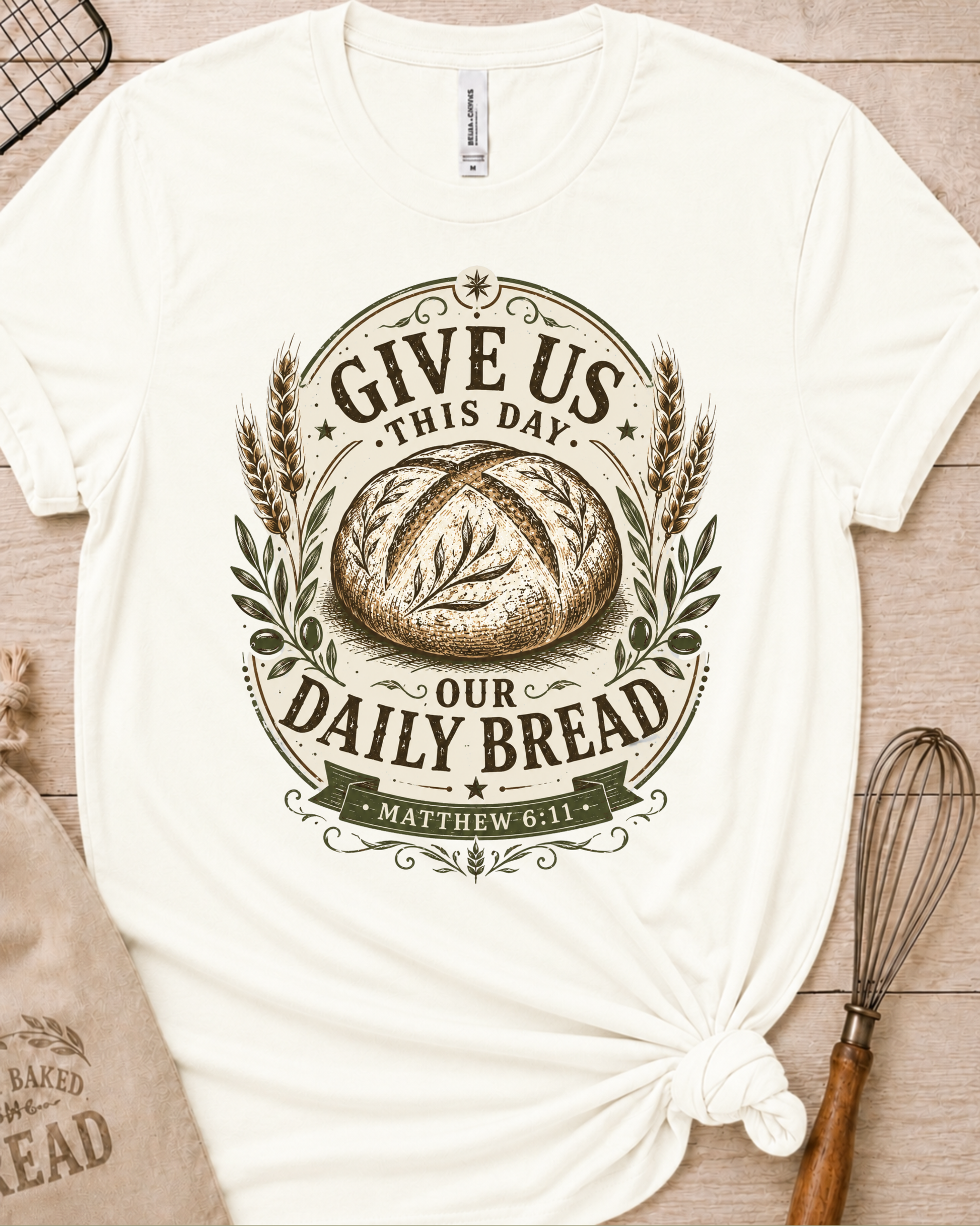 Vintage white women's relaxed fit t-shirt with the Daily Bread emblem printed in cream, a clean badge-style bread illustration inspired by Matthew 6:11.