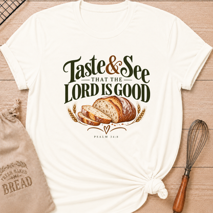 Vintage White women's relaxed fit tee with bold vintage Taste and See That the Lord Is Good lettering above a sliced artisan loaf, golden wheat, and Psalm 34:8