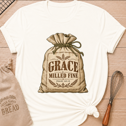 Vintage White women's relaxed fit tee with a vintage flour sack tied with rope, detailed with wheat motifs, Grace Milled Fine lettering and Psalm 145:15