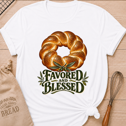 White women's relaxed fit tee with a braided loaf accented with olive branches and bold vintage Favored and Blessed lettering in deep earthy tones