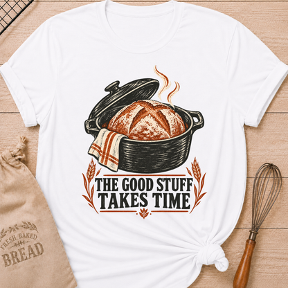 White women's relaxed fit tee with a warm artisan loaf rising from a classic Dutch oven with wheat accents and vintage distressed Good Stuff Takes Time lettering