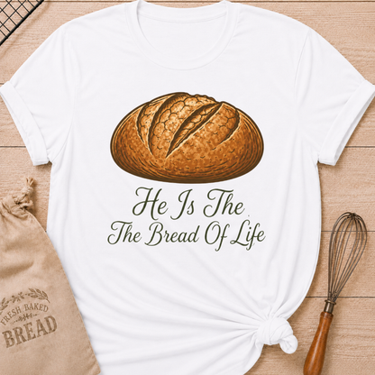 White women's relaxed fit t-shirt with the words He Is the Bread of Life in graceful vintage lettering and an illustrated artisan loaf.