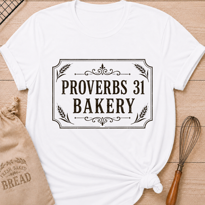 White women's relaxed fit t-shirt with Proverbs 31 Bakery in classic lettering framed by wheat and ornamental details.