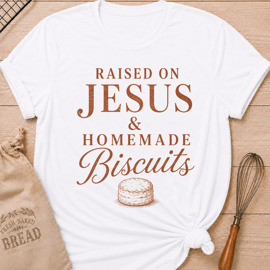 White Raised On Jesus and Homemade Biscuits women's relaxed fit tee with warm vintage typography and a classic biscuit