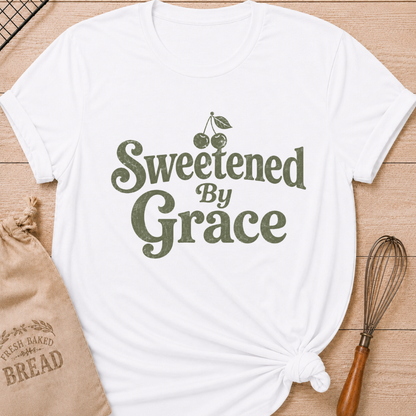 White women's relaxed fit t-shirt with the words Sweetened by Grace in playful vintage lettering and a cherry.